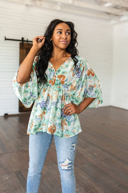 Fabled in Floral Draped Peplum Top in Ivory (Online Exclusive) - Uptown Boutique Ramona