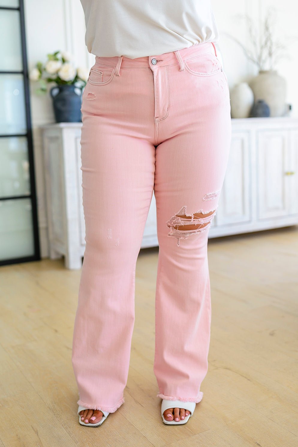 Feminine Flair Mid Rise Distressed Flares in Pastel Pink (Online Exclusive) - Uptown Boutique Ramona