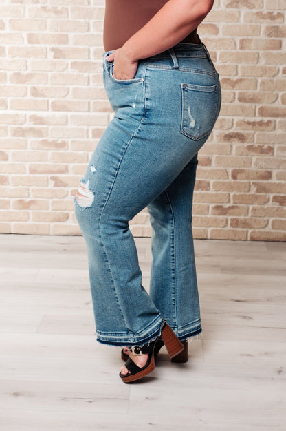 Isla Mid Rise Distressed Released Hem Bootcut Jeans (Online Exclusive) - Uptown Boutique Ramona