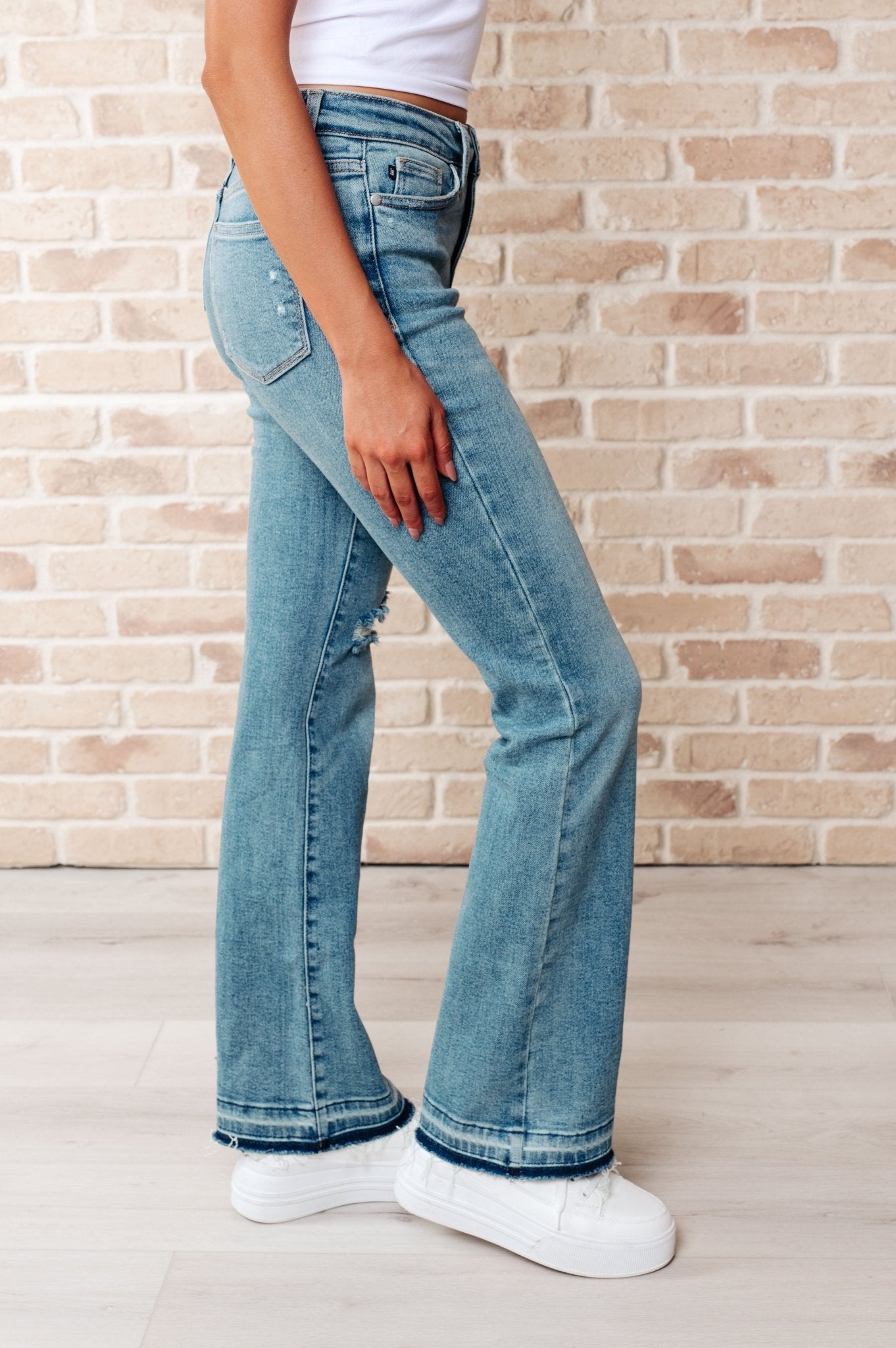 Isla Mid Rise Distressed Released Hem Bootcut Jeans (Online Exclusive) - Uptown Boutique Ramona