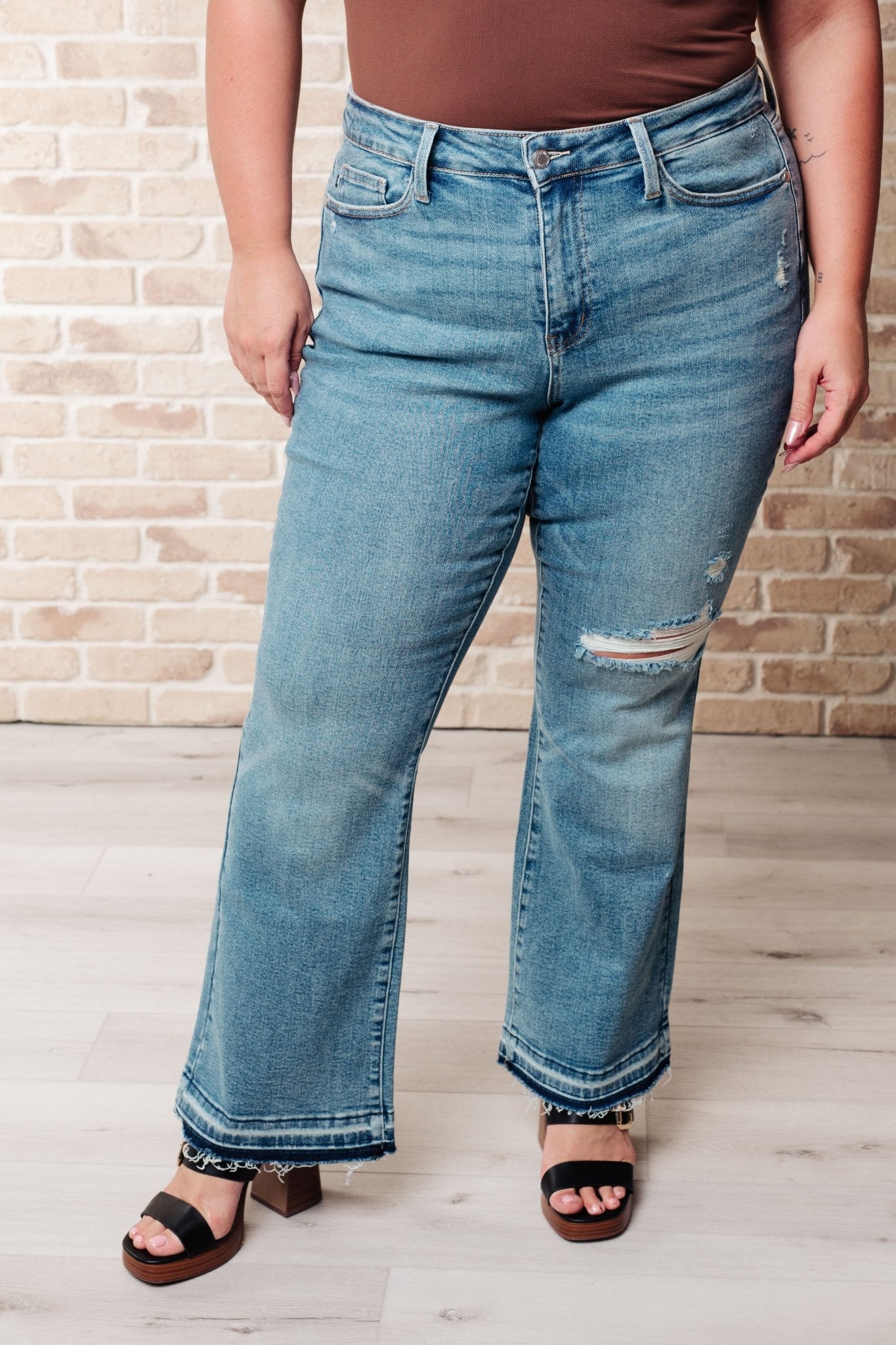 Isla Mid Rise Distressed Released Hem Bootcut Jeans (Online Exclusive) - Uptown Boutique Ramona