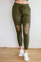 Kick Back Distressed Joggers in Olive (Online Exclusive) - Uptown Boutique Ramona